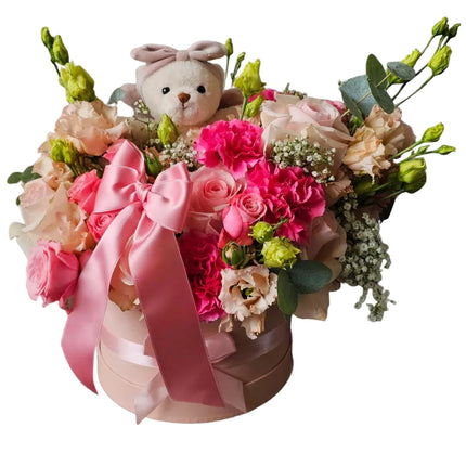 Rosa Blumenbox mit frischen Blumen und Kuschelbär als Baby Geschenk zur Geburt online bestellen Zürich