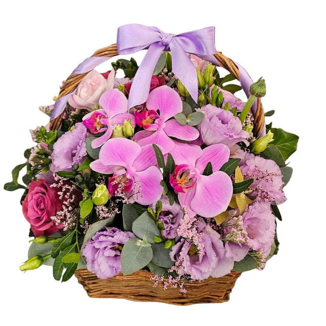 Blumenkorb mit Rosen rosa Orchideen und lila Lisianthus in Zürich bestellen