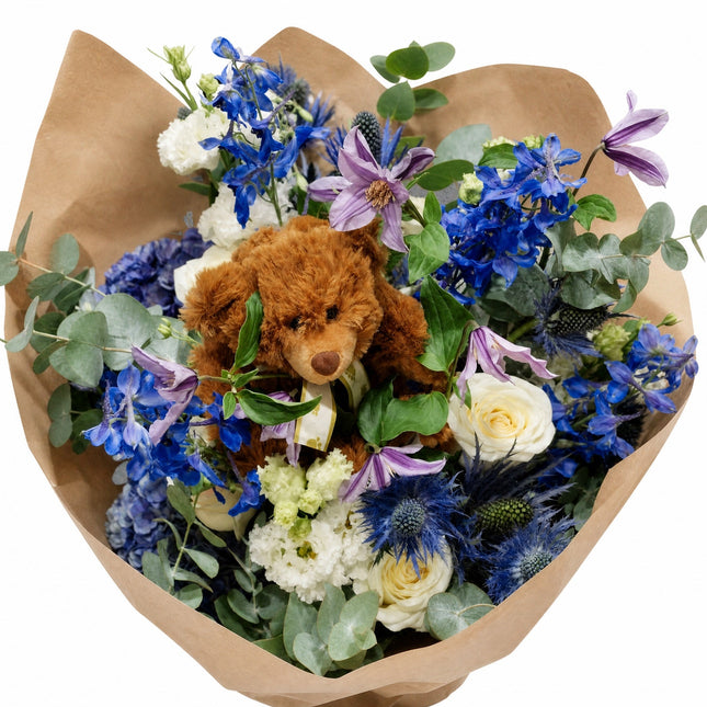 Blumenstrauss zur Geburt eines Jungen mit Kuschelbär aus Zürich online bestellen