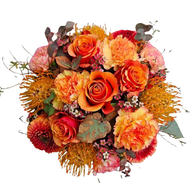 Herbstzauber Blumenkorb mit Rosen, Nelken und exotischen Blüten in warmen Herbstfarben
