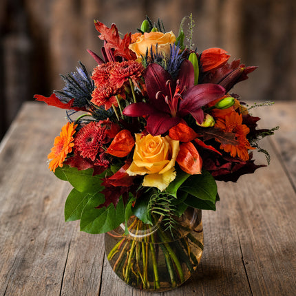 Herbststrauss mit Rosen Lilien Chrysanthemen und Physalis in Orange Rot Gelb und Bordeaux in Zürich liefern lassen
